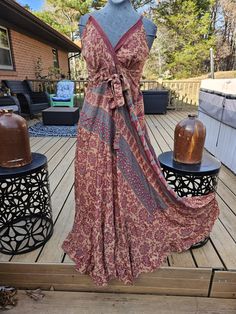 "This is a beautiful empire waist maxi dress , one of a kind handcrafted from vintage silk . Has a V neck , adjustable straps and smocked at the back . Measurement (appx): Bust:  36 \" with elastic waist stretch upto 42\" Height: 56 \"( measured from the shoulder line to the bottom ) ONE size fits most from S to L ,please refer to the measurements before purchasing . Has a tie by the bust for a chic look . Thank you looking , stay safe !" Bohemian Long Dress With Smocked Back, Bohemian Halter Neck Fitted Sundress, Bohemian Halter Neck Flowy Sundress, Sleeveless Bohemian Maxi Dress With Smocked Back, Flowy Bohemian Dress With Empire Waist, Bohemian Maxi Dress With Smocked Back For Summer, Bohemian Fitted Halter Neck Sundress, Bohemian Flowy Halter Neck Sundress, Flowy Bohemian Halter Neck Sundress