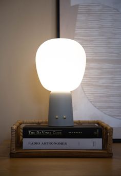 a lamp that is on top of some books