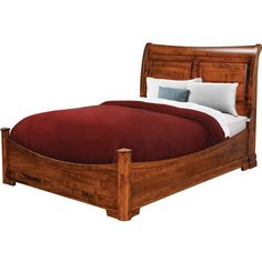 a wooden bed frame with red sheets and pillows