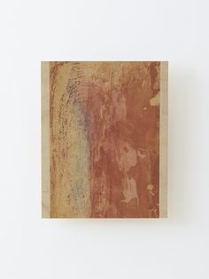 an abstract painting is displayed on the wall