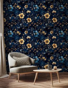 a chair and table in front of a wallpapered room with flowers on it