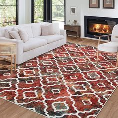 a living room filled with furniture and a fire place