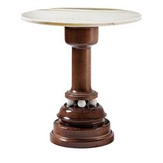 a marble topped table with wooden pedestals and two balls on the top, against a white background