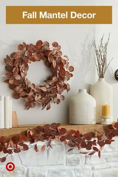 a fireplace mantle with a wreath and candles on it that says fall mantel decor