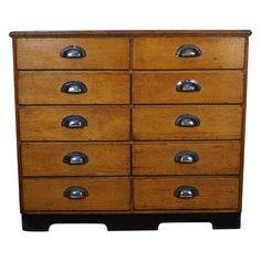 an old wooden dresser with metal knobs on it's doors and drawer drawers