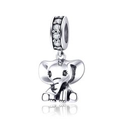 an elephant charm with diamonds on it's face and its trunk in the air