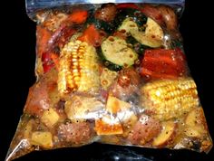 a bag filled with meat and vegetables on top of a stove