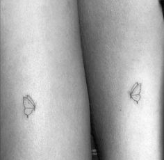 two small tattoos on the legs of someone's legs, one with a butterfly