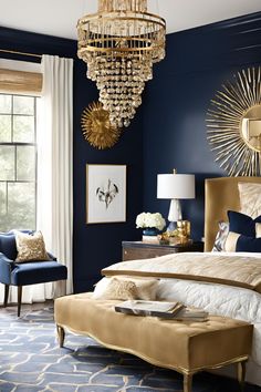 a bedroom decorated in blue and gold with a chandelier hanging from the ceiling