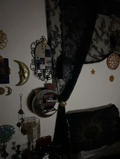 there are many clocks hanging on the wall in this room, and one is upside down