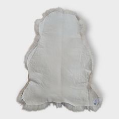 a white sheepskin rug on a white background