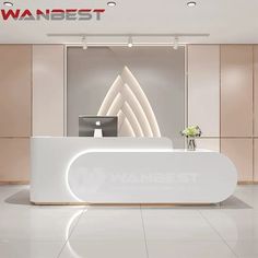 a white reception desk with a laptop on it in front of a sign that says wanbest