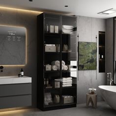 a bathroom with a tub, sink and large mirror on the wall next to it