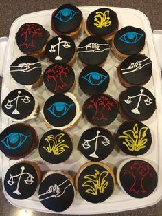 cupcakes decorated with the symbols of zodiac signs