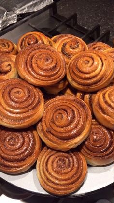 there are many cinnamon rolls on the plate