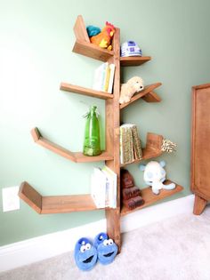 there is a wooden shelf with books on it in the corner next to a bed