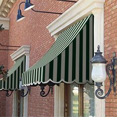 an awning on the side of a brick building