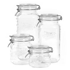 three clear glass jars with metal lids