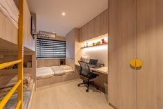 a bedroom with bunk beds and desk in it