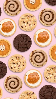 an assortment of cookies and pastries on a pink background