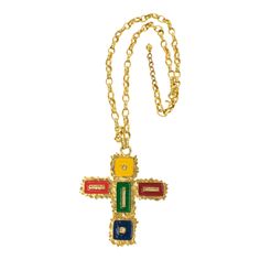 This gorgeous Mercedes Robirosa Paris couture pendant necklace features an oversized gilt metal all-textured and pierced cross pendant ornate with enamel in red, green, blue, and yellow. The heavy gilded metal chain has a hook-closing clasp and chain for length flexibility. The signature is engraved on the underside of the pendant: Mercedes Robirosa. Measurements: Necklace total length is 31.10 in (79 cm) - drop is 18.50 in long (47 cm) - pendant is 3.44 in wide (8.7 cm) x 3.98 in high (10.1 cm) Enamel Cross, Vintage Pendant Necklace, Paris Couture, Pearl Chain Necklace, Chanel Couture, Cameo Pendant, Geometric Pendant, Chain Necklaces, Cross Pendant Necklace