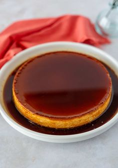 a bowl filled with sauce on top of a table