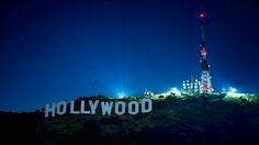 the hollywood sign is lit up at night