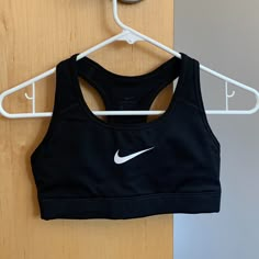 Black Nike Dri-Fit Sports Bra In Size Xs. Only Worn A Handful Of Times, In Basically Brand New Condition. Does Not Come With Pads But Comes With Pockets For Adding Or Removing Them (Please See Pictures). From Smoke Free, Pet Free Home. Feel Free To Make Me An Offer! :) Nike Black Activewear For Light Sports, Cheap Nike Sports Bra, Nike Black Sports Bra For Athletics, Nike Fitted Casual Sports Bra, Athletic Tops, Black Nike Sports Bra For Sports, Sports Bra Nike, Fitted Black Nike Sports Bra, Nike Athletic Fit Sports Bra With Go-dry