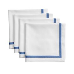 four white napkins with blue trim on each side and one in the middle, sitting next to each other