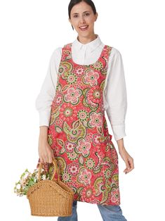 a woman in an apron holding a basket