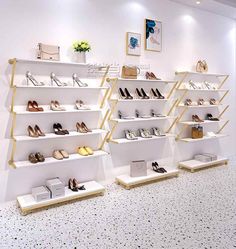 the shelves are filled with shoes and purses