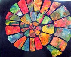 an art project made out of stained glass and paper with the shape of a sunburst