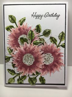 a birthday card with pink flowers and green leaves