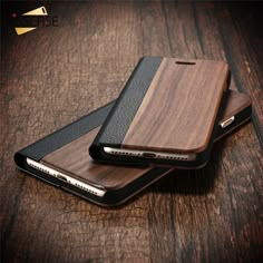 two wooden iphone cases sitting on top of each other