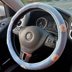 the steering wheel cover has flowers on it