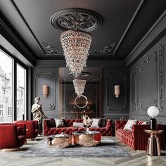 a living room with red couches and chandelier in the middle of it