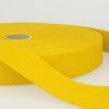 a roll of yellow tape sitting on top of a white table