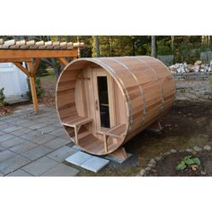 a wooden sauna in the middle of a yard