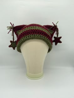 a crocheted hat on a mannequin head