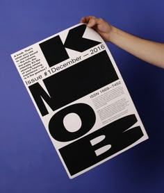 a person holding up a black and white poster with the words work now on it