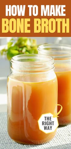 two jars filled with orange liquid sitting on top of a table next to each other