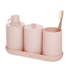 pink bathroom accessories set with toothbrush and soap dispenser