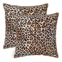 two leopard print pillows sitting next to each other