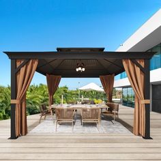 an outdoor dining area with patio furniture and umbrellas