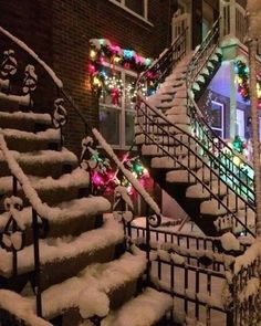 the stairs are covered in snow and decorated with christmas lights