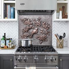 a stove top oven sitting inside of a kitchen next to a wall mounted pot and pan