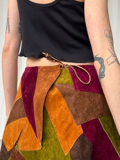 Vintage handmade patchwork leather maxi skirt. Has an adjustable tie at the waist to close. MEASUREMENTS (in inches) 26 in waist 54 in hips 37 in length MATERIALS Leather Have a question? Email us All items are FINAL SALE. Vintage pieces are pre-loved and may come with minor flaws, condition will be noted in description. For questions or concerns, please Email us at hello@shopbanshee.com. If purchasing through Meta all policies still apply. Patchwork Leather Skirt, Leather Patchwork, Statement Shoe, Urban Renewal, Leather Denim, 1970s Fashion