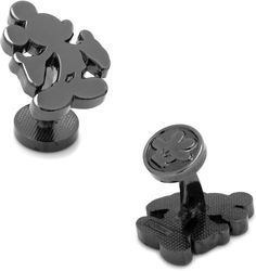 two black and silver cufflinks with mickey mouse on it's back end