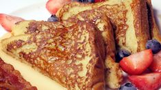 french toast with strawberries and blueberries on a plate