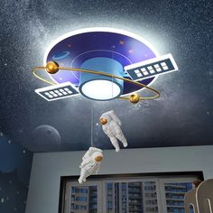 an astronaut themed ceiling light in a child's room